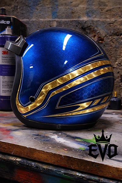candy blue paint on a motorcycle helmet with gold leaf and pinstriping